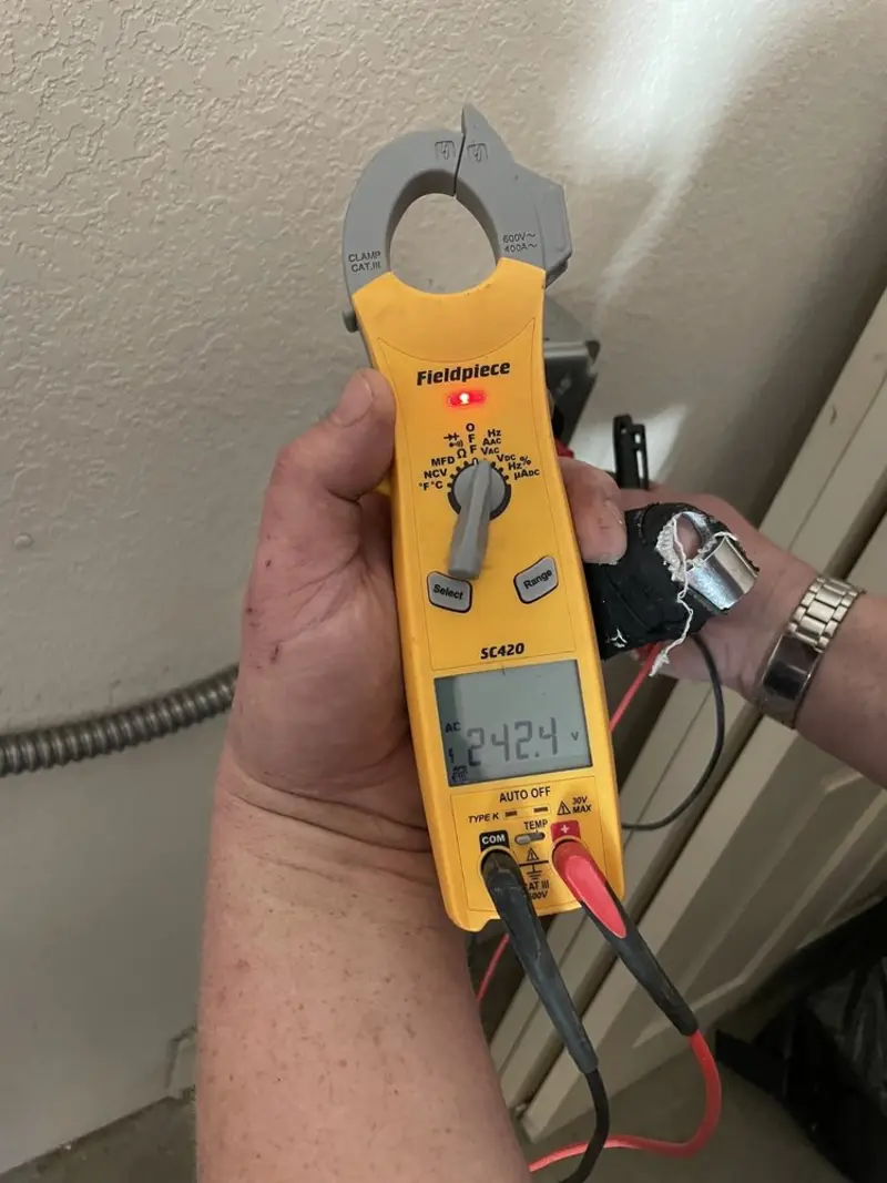 Voltage testing with clamp meter during Electrical Installation Services in Woodstock